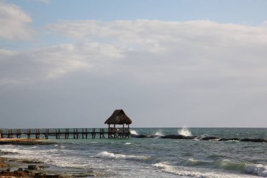 Gazebo in sea near tropical beach on sunny day