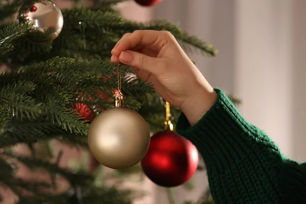 Woman Decorating Christmas Tree Beautiful Golden Bauble Closeup — Fotografia de Stock