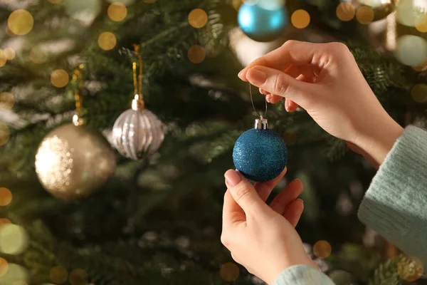 Woman Decorating Christmas Tree Beautiful Light Blue Bauble Closeup — Fotografia de Stock