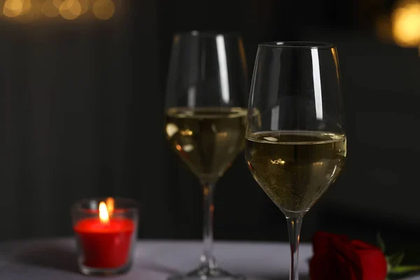 Glasses White Wine Burning Candle Rose Flower Table Blurred Lights — Stock Fotó
