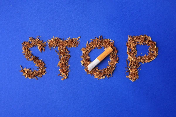Word Stop Made Dry Tobacco Broken Cigarette Blue Background Flat — ストック写真