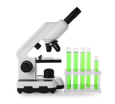 Test tubes with green liquid and microscope isolated on white