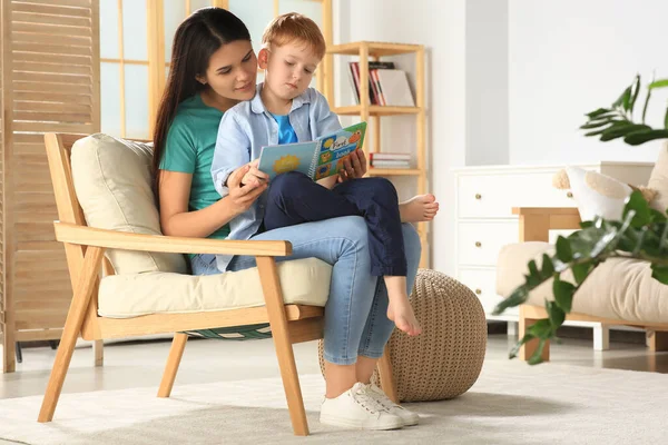 Mother Reading Book Her Son Armchair Living Room Home — Stock Fotó