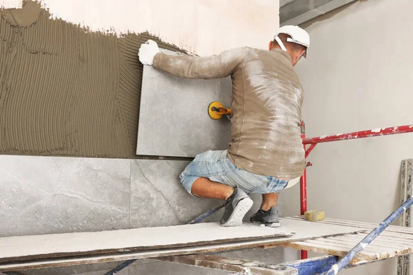 Worker Installing Wall Tile Vacuum Holder Indoors Back View — Fotografia de Stock