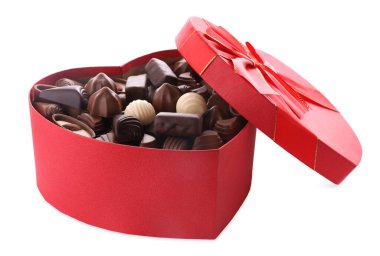 Heart shaped box with delicious chocolate candies on white background