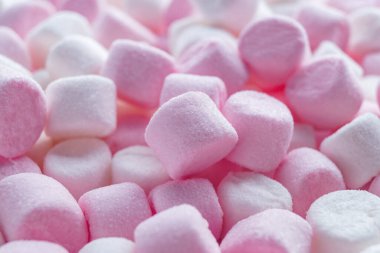 Delicious puffy pink and white marshmallows as background, closeup