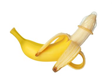 Banana with condom isolated on white. Safe sex concept