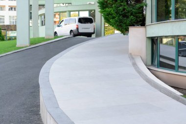Beautiful city street with rising road on autumn day