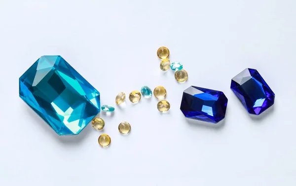 Different Beautiful Gemstones Jewelry White Background Flat Lay — Fotografia de Stock