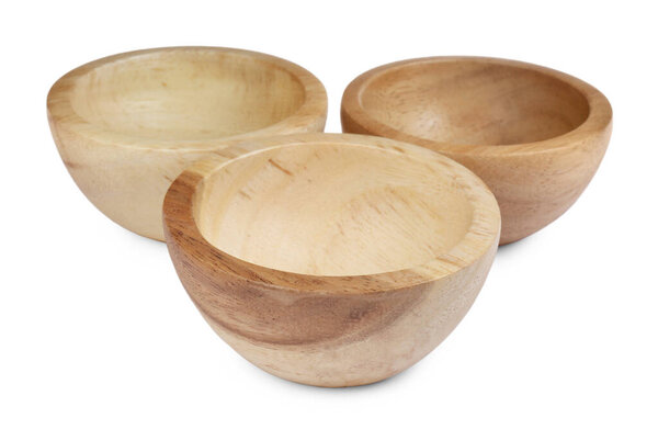 Set of wooden bowls on white background