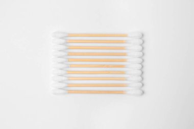 Many clean cotton buds isolated on white, top view