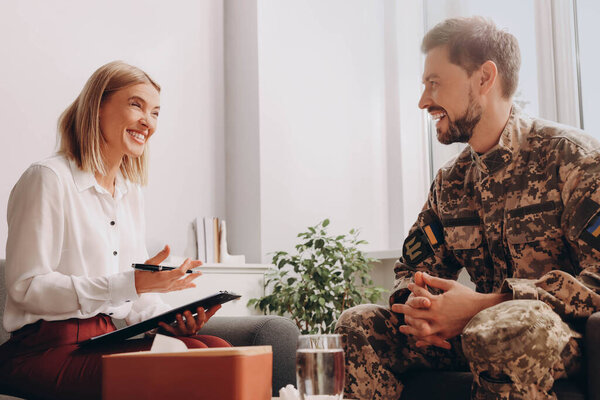 Psychologist working with military officer in office