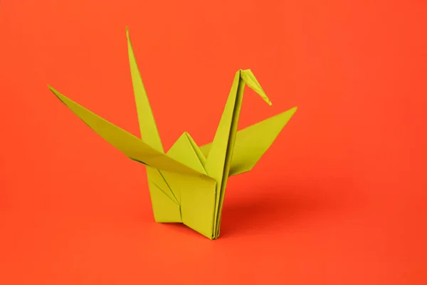 Red Origami Paper Crane On Red Background Closeup High-Res Stock