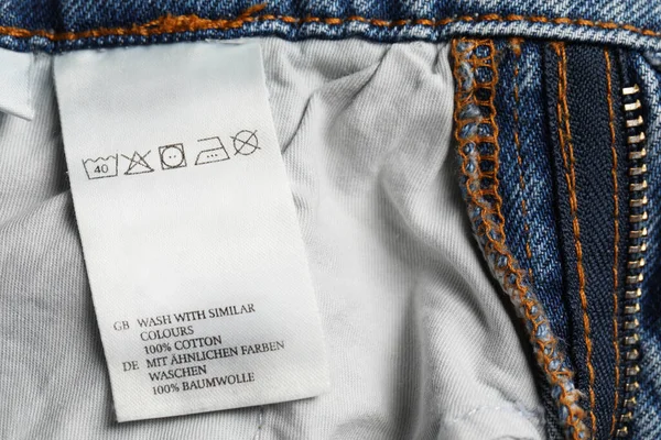 Clothing label on jeans garment, closeup view