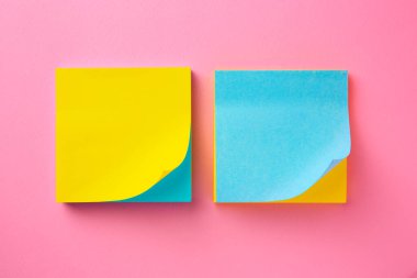 Blank paper notes on pink background, flat lay