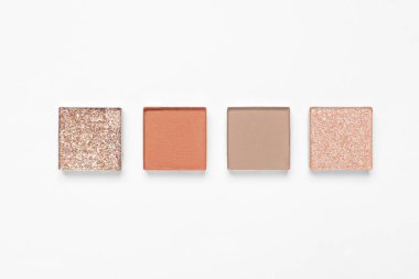 Different beautiful eye shadows on white background, flat lay