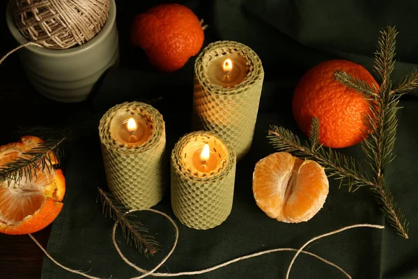 Beautiful Burning Beeswax Candles Rope Tangerines Table View — Stockfoto