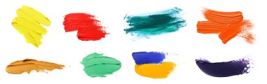 Set with strokes of colorful oil paints on white background, top view
