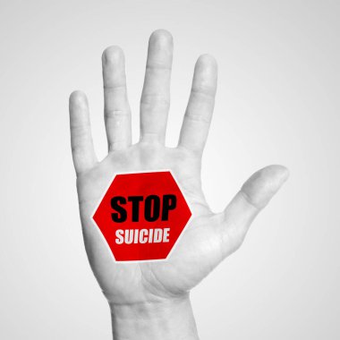 Man showing palm with warning sign and words Prevent Suicide on white background, closeup. Black and white photo with red color accent