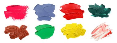 Set with strokes of colorful oil paints on white background, top view