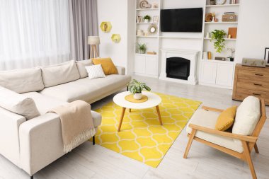 Spring atmosphere. Stylish room interior with cozy furniture and potted plants