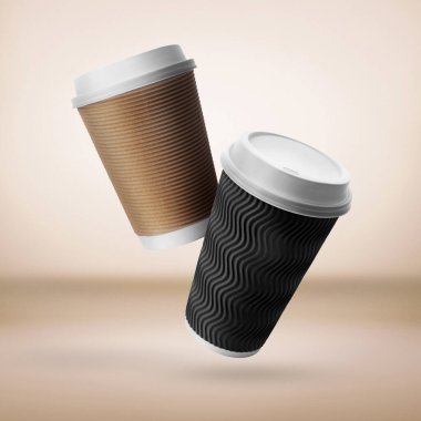 Takeaway paper cups falling on beige background