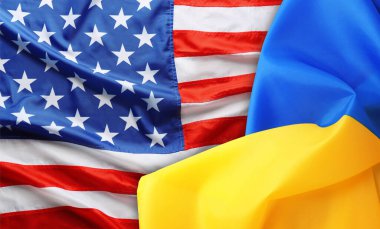 National flags of Ukraine and USA symbolizing partnership between countries