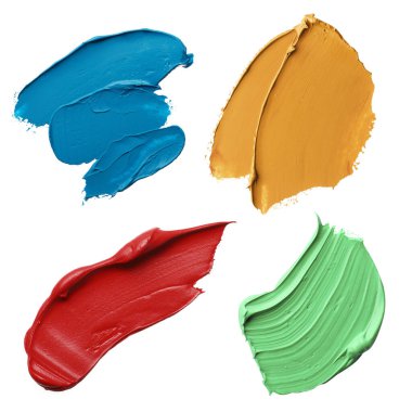 Set with strokes of colorful oil paints on white background, top view