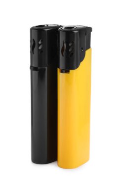 Stylish small pocket lighters on white background