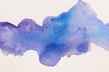 Blot of colorful watercolor paint on white paper, top view