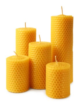 Stylish elegant beeswax candles isolated on white