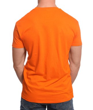 Man wearing orange t-shirt on white background, back view. Mockup for design