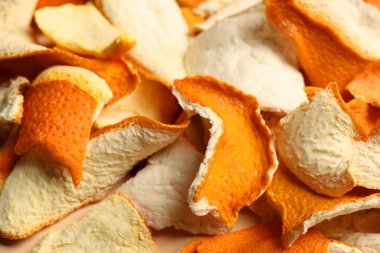 Many dry orange peels as background, closeup