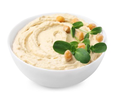 Bowl of delicious hummus with chickpeas isolated on white