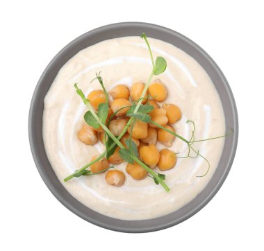 Tasty chickpea soup in bowl on white background, top view