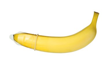 Banana with condom isolated on white. Safe sex concept