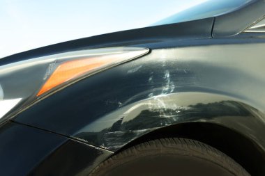 Modern black car with scratch, closeup view