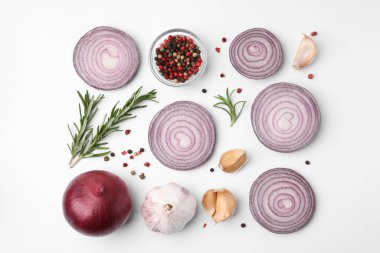 Fresh red onions, garlic, rosemary and spices on white background, flat lay