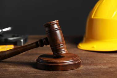Construction and land law concepts. Gavel on wooden table, closeup