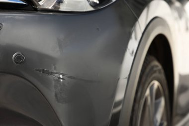 Modern black car with scratch, closeup view