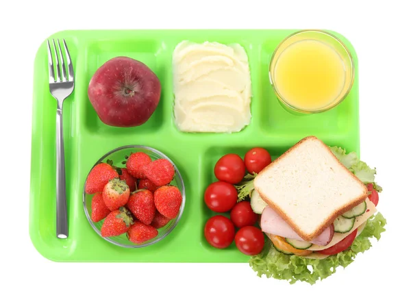 Serving tray of healthy food isolated on white, top view. School lunch