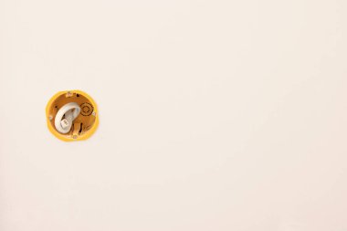 Mounting box with white wire on wall indoors, space for text. Installation of socket