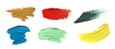 Set with strokes of colorful oil paints on white background, top view