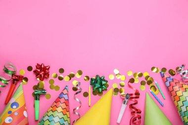 Flat lay composition with party items on pink background, space for text. Birthday celebration