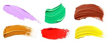 Set with strokes of colorful oil paints on white background, top view