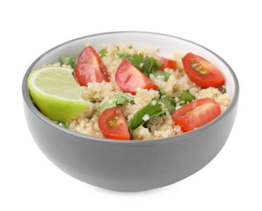 Delicious quinoa salad with tomatoes, parsley and lime isolated on white