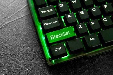 Green button with word Blacklist on computer keyboard, closeup