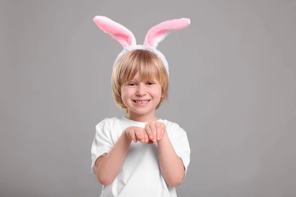Happy Boy Wearing Bunny Ears Headband Grey Background Easter Celebration — Stockfoto