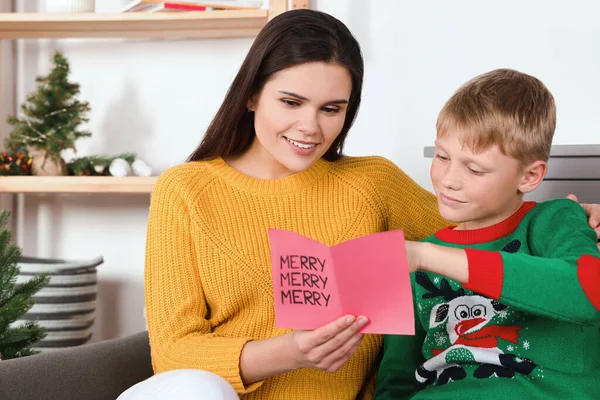 Happy Woman Receiving Greeting Card Her Son Home — Zdjęcie stockowe