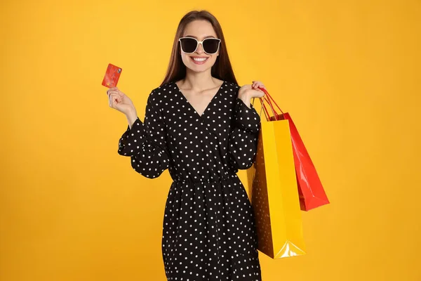 Happy Young Woman Shopping Bags Credit Card Yellow Background Big — Stock fotografie